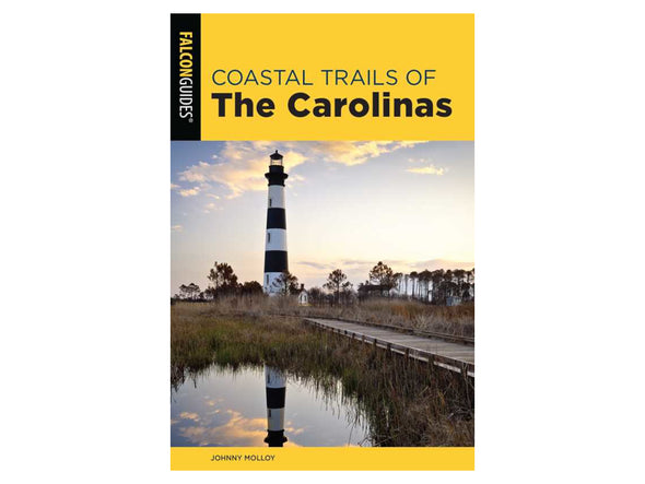Book cover of 'Coastal Trails of The Carolinas' with a lighthouse and coastal path.