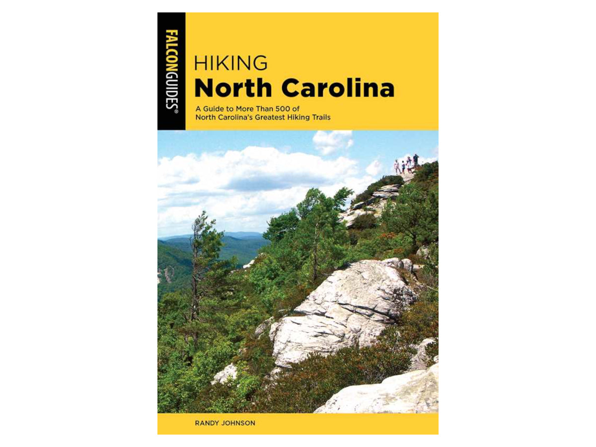 Book cover of 'Hiking North Carolina' by Falcon Guides with a scenic view of mountains and trees.