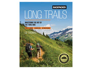 Book cover of 'Long Trails' by Liz Thomas with hikers on a trail and mountains in the background.